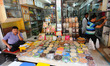 Indian shopkeeper  wait for customers in the main wholesale market area of the city in Kol...