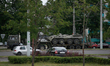 A armoured personal carrier is seen being transported through the center of Brest, Belarus...
