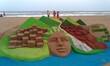 Visitors look near to sand sculpture creating by local sand artists on the eve of World En...