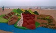 Visitors look near to sand sculpture creating by local sand artists on the eve of World En...