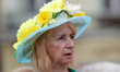 A woman with a flower hat is seen in the center of the old city on 10 June, 2017. 