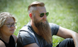 Bear-wearers commonly known n this particular style as hipsters are seen at a bear-wearer...