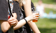 A young woman is seen carrying a beer during the summer season opening festival in Mysleci...