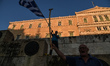 Greeks attending an anti government rally organized by the mostly conservative “Resign” mo...