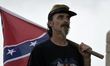 People leave the Civil War battlegrounds in Gettysburg, Pennsylvania, ahead of a storm, on...
