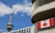 CN Tower and Canadian flag on the balcony of a residence in the city of Toronto, Ontario,...