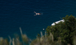 A woman is seen swimming in the Adriatic see off the coast of the island of Krk on 28 July...