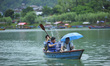 Tourists enjoying boating at Fewa Lake, Pokhara, Nepal on Sunday, July 30, 2017. 
