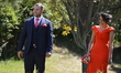 A man and a woman can be seen smiling before a wedding ceremony as people enjoy 10-day hol...