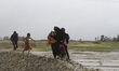 Rohingya refugees walk toward refugee camp after crosses Myanmar-Bangladesh border at Tekn...