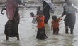 Rohingya refugees walk toward refugee camp after crosses Myanmar-Bangladesh border at Tekn...