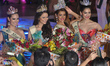 The winners of Miss Earth 2013 Pageant (L-R) Miss Fire Catharina Choi of Korea, Miss Air K...