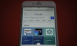 Amazon applications for download are seen on a Google search page on an iPhone on October...