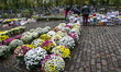 Flowers and candles sellers in front of the Garrison Cemetery in Gdansk, Poland is seen on...