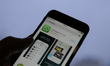 The logo of the Whatsapp messaging application is seen in this photo illustration on Novem...