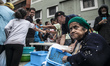 Volunteers distribute food to venezuelan people in Caracas, Venezula, on 23 November 2017....