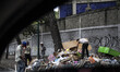 People looking for food residues in the garbage in Caracas, Venezula, on 23 November 2017....