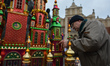 A man fixes the Nativity Scene on display in Krakow's Main Square, during the 75th Nativit...
