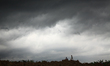 Kids playing under the dark cloud which hanging over residential area in the district of C...