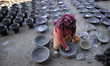 TIL MAYA PRAJAPATI, 68 yrs, making clay pot on her workshop at Thimi, Bhaktapur, Nepal on...