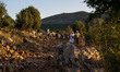 A man help a nun on a steep path that leads on the very place of the apparitions of Our La...