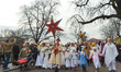 Young performers dressed as angels follow a man carrying the star during the annual 'Orsza...