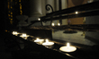 Candles are seen at an altar for praying in the Vincent de Paul basilica in Bydgoszcz, Pol...