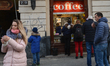 A view of people queing for a coffee in a local take away shop.On Monday, January 15, 201...