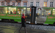 A young lady walk on Rynok Square near the passing by tramway.On Monday, January 15, 2018...