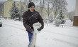 A municipal worker is seen sprinkling salt in Bydgozcz, Poland on January 16, 2018. More s...