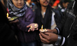 Nepalese students offering butter lamps towards idol goddess Goddess of Wisdom Saraswati d...