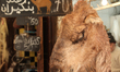 The head of a camel hangs by a shop selling camel meat in Fez (Fes) in Morocco, Africa. 