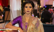 Indian model wearing an exquisite outfit during a South Indian and Tamil bridal fashion sh...