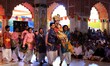 Men and women play 'Lathmar Holi 'on the occasion of 'Fag Mahotsav' at historical Govind D...