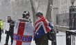Men walk near Westminster area during a heavy snowfall, London on February 28, 2018. Londo...