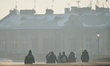 A group of young people walk inside Wawel Castle in Krakow, as icy weather continues in Kr...