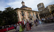 Falleros dressed up in traditional costume prepare to present flowers to Saint Mary during...