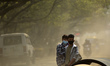 Nepalese youths awaiting for local bus in the dusty air at Kathmandu, Nepal on Thursday, M...