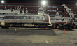 A train set of Light Rail Transit (LRT) pulls out from the cargo ship upon arrival at Tanj...