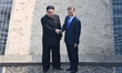 North Korean Leader Kim Jong Un and South Korean President Moon Jae-in shake hands over th...