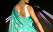 Indian woman wearing an elegant and ornate Kanchipuram saree (Kanjivaram saree) during a S...