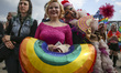 People attend the Equality March in Krakow, Poland on 19 May, 2018. LGBT people and their...