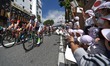 Young Japanese fans with flags near the start of Minami Shinshu stage, 123.6km on Shimohis...