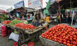Street vendor sells tomatos on Bazaar in Old city of Kabul, Afghanistan