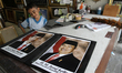 A child noticed a portrait of the President of Indonesia, Joko Widodo (L) and his deputy,...