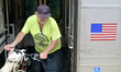 Passenger with a bicycle exits the Atlantic City Rail Line commuter train at the train sta...