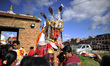 Nepalese devotees offering holy grains towards Idols of Dipankar Buddha during Pancha Dan...