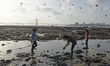 Volunteers collect garbage from a beach in Mumbai.  