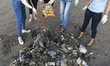 Volunteers collect garbages from a beach in Mumbai 