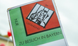 Sign saing 'In Prison - Only visiting Bavaria'. Up to 40.000 people protested in Munich, G...